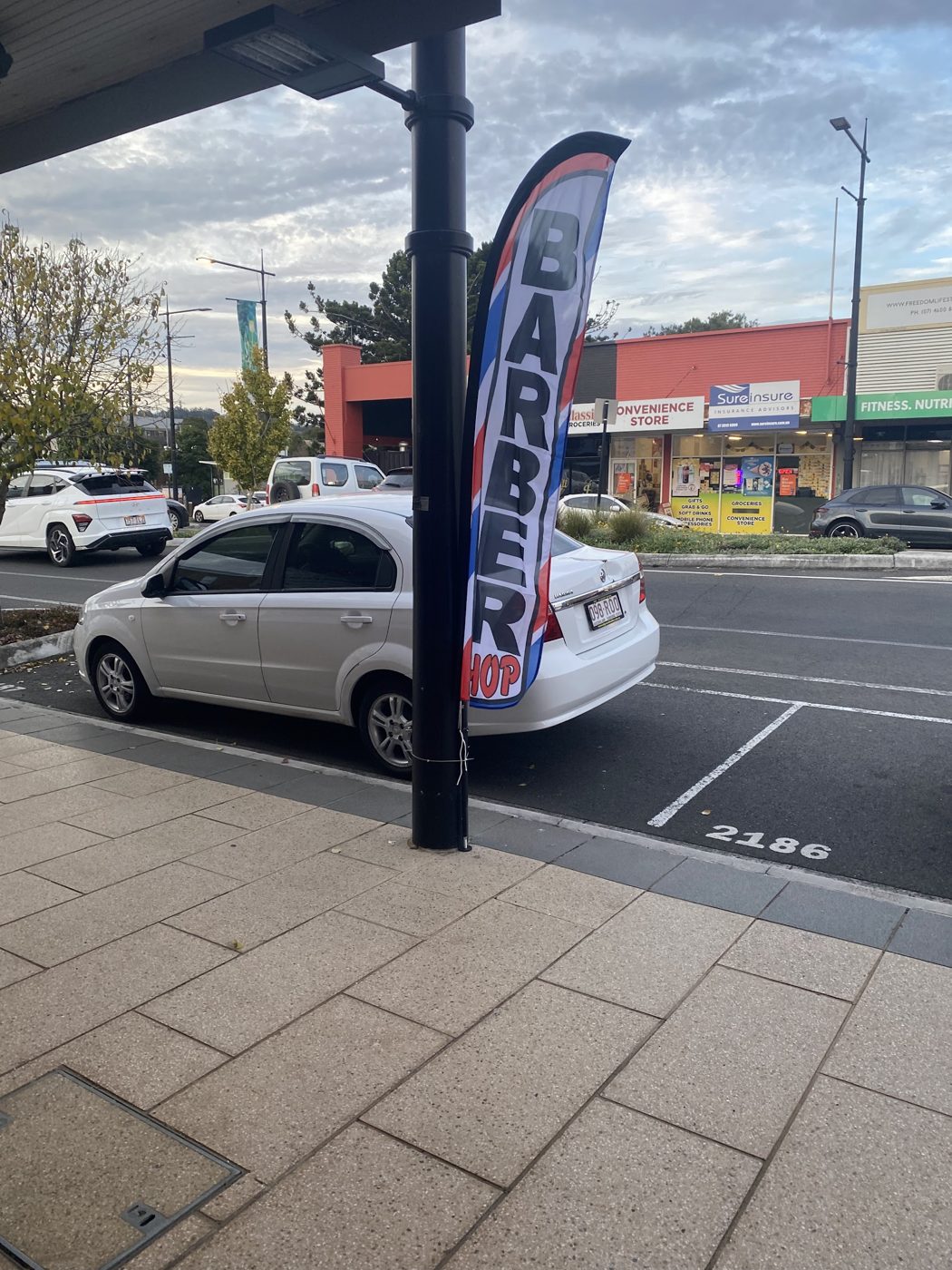 Barber shop flag out the front on Ruthven Street